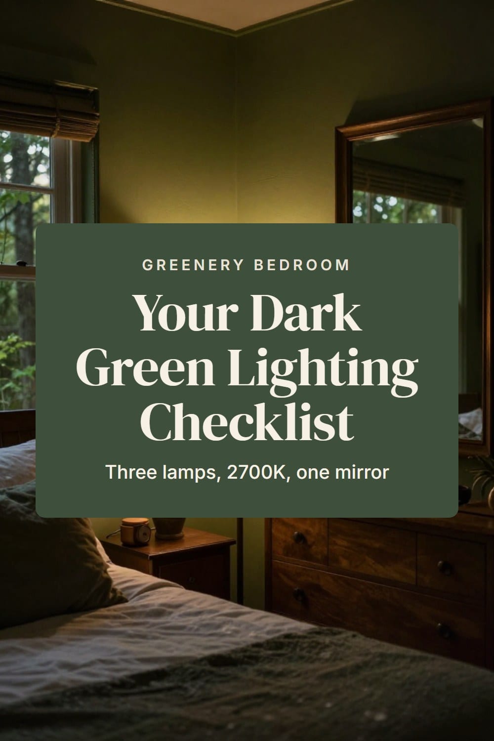 Forest green bedroom lit by two bedside lamps and a taller dresser lamp with a large mirror on the far wall