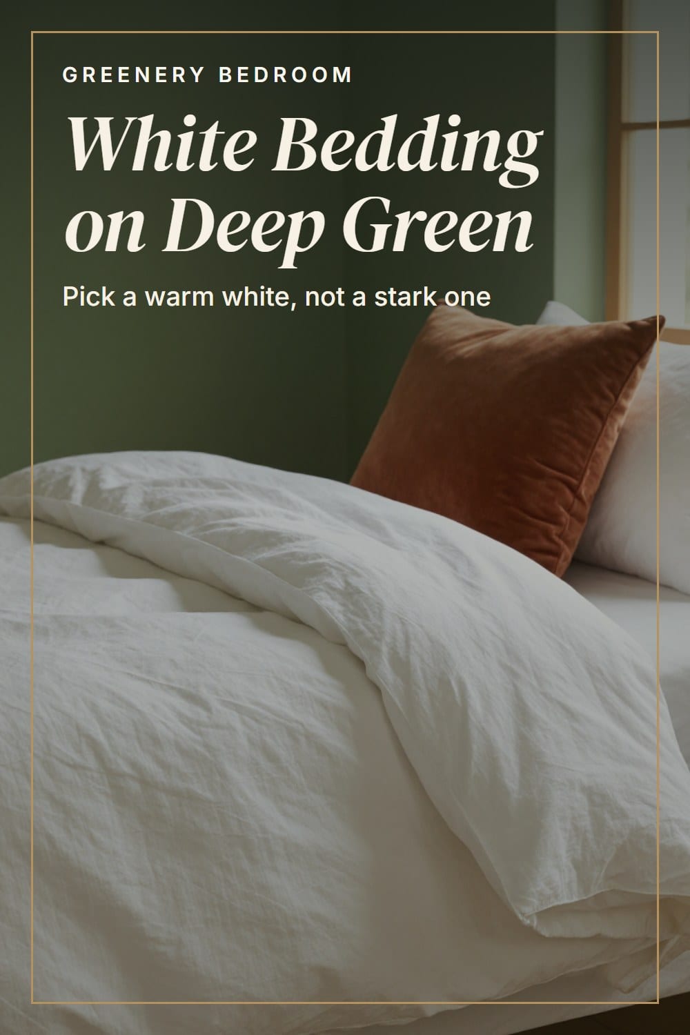 Crisp warm white linen bedding with soft creases against a forest green wall and a rust velvet pillow
