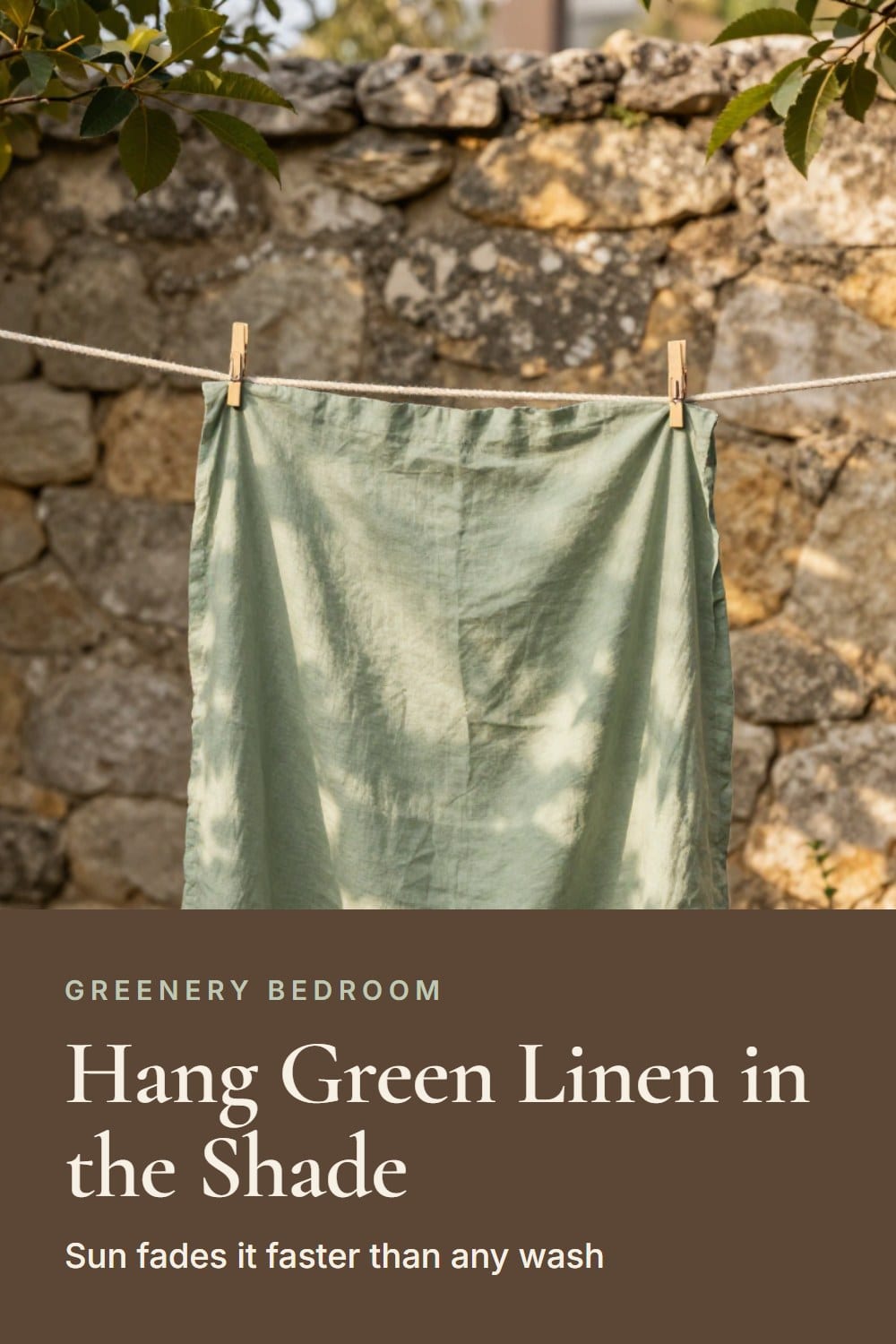 Sage green linen sheets drying on a wooden clothesline in dappled garden shade