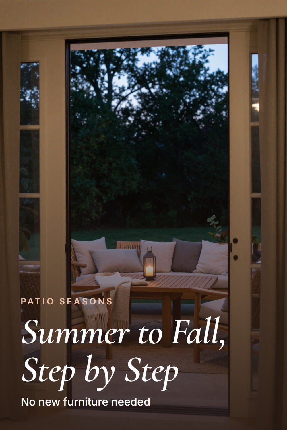 Doorway framing looking out onto a fall-styled patio with layered cushions and a lantern
