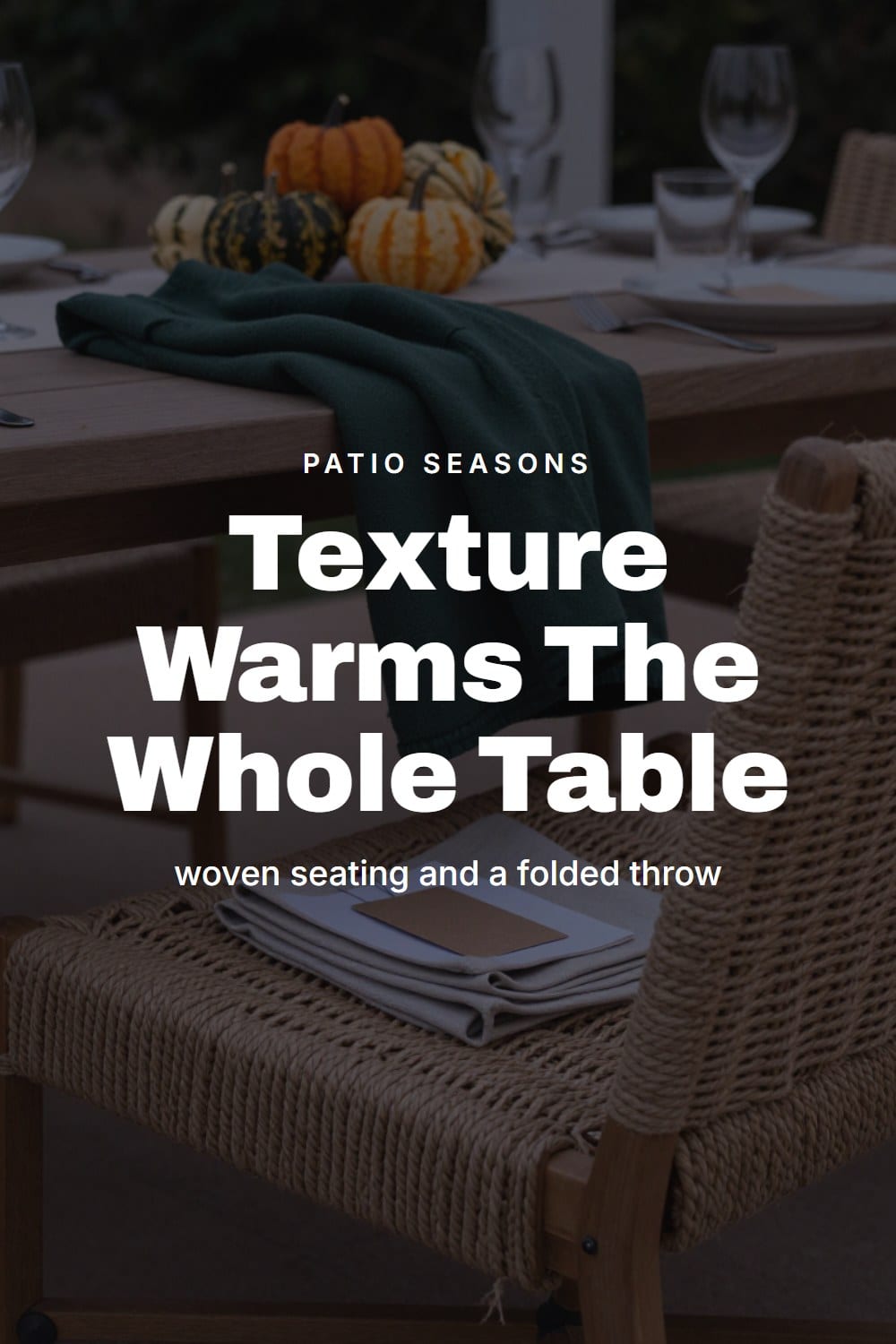 A low-angle detail of a woven rope-weave chair seat beside a folded throw at a fall dinner table