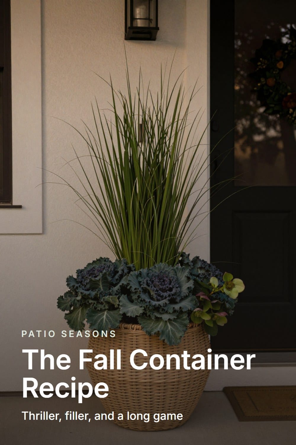 Doorway framing of a fall porch container planted with grass, kale, and hellebores beside the front entry