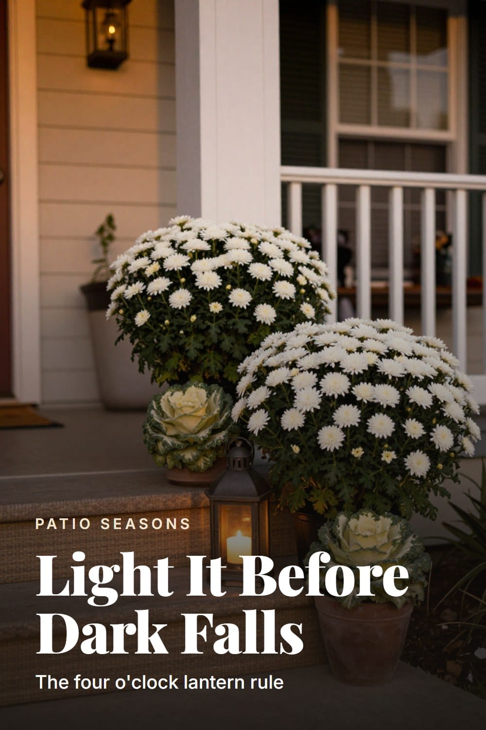 Planters grouped at the porch step edge beside a warm lit lantern in early fall light