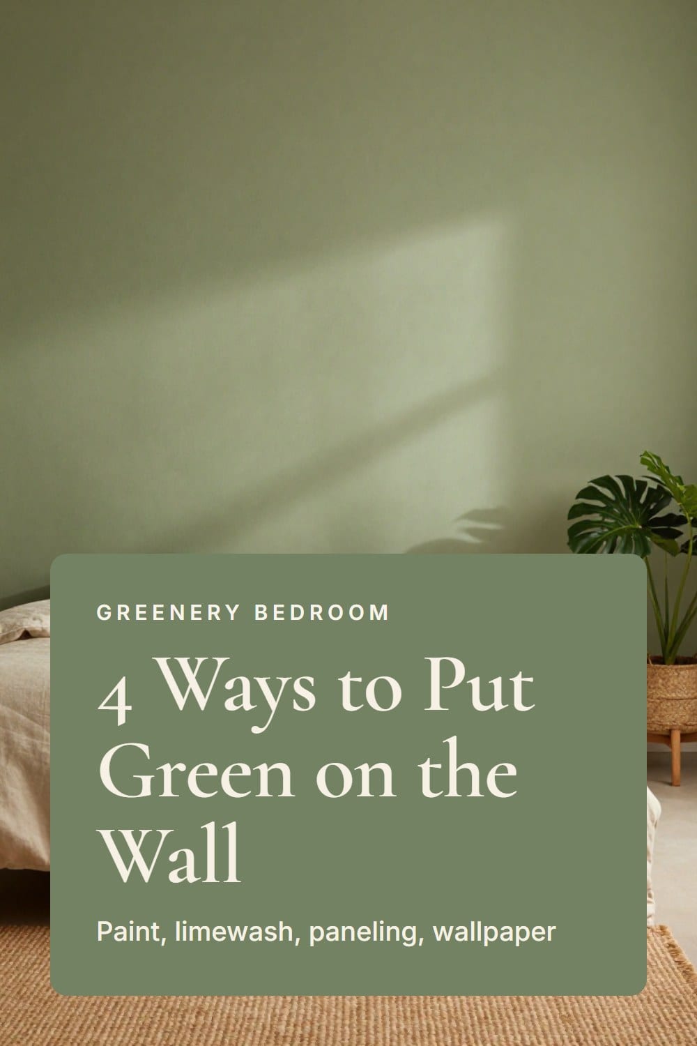 A bed against a limewashed green wall with cloudy movement, oatmeal linen duvet and a jute rug