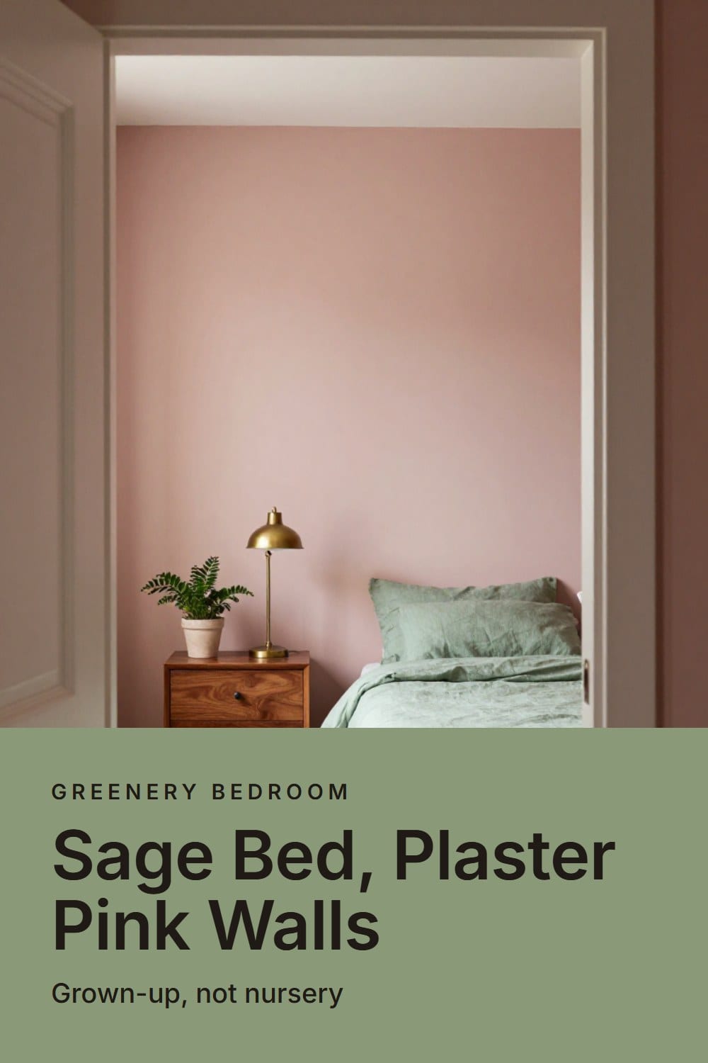 Sage green linen bed against dusty plaster pink walls with a walnut nightstand and aged brass lamp in morning light