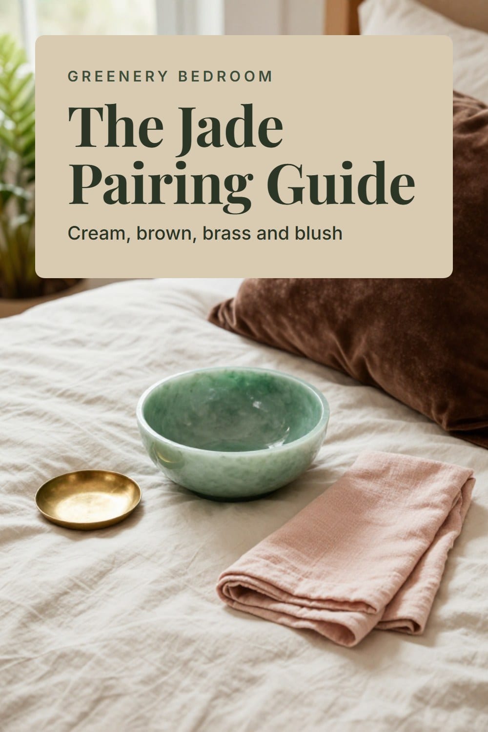 Overhead arrangement of a jade glazed bowl, a chocolate brown velvet pillow, an aged brass dish and a blush linen napkin on a cream duvet