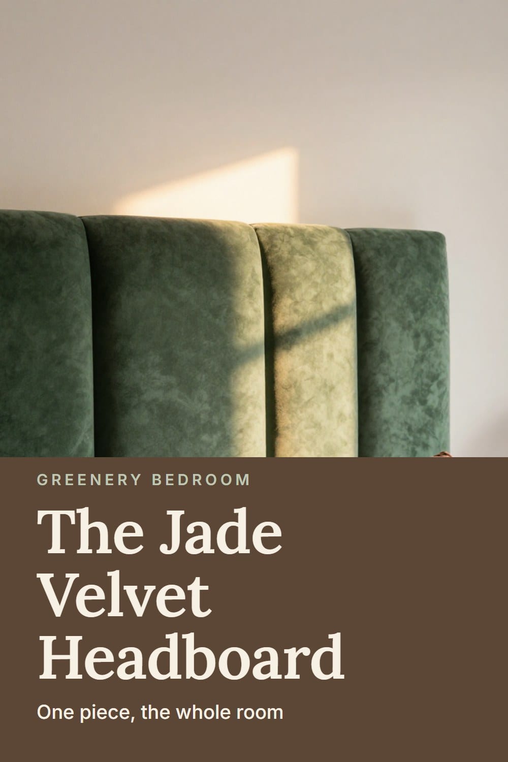 A jade green velvet headboard with soft pile catching lamplight above crumpled white percale and a brown velvet pillow