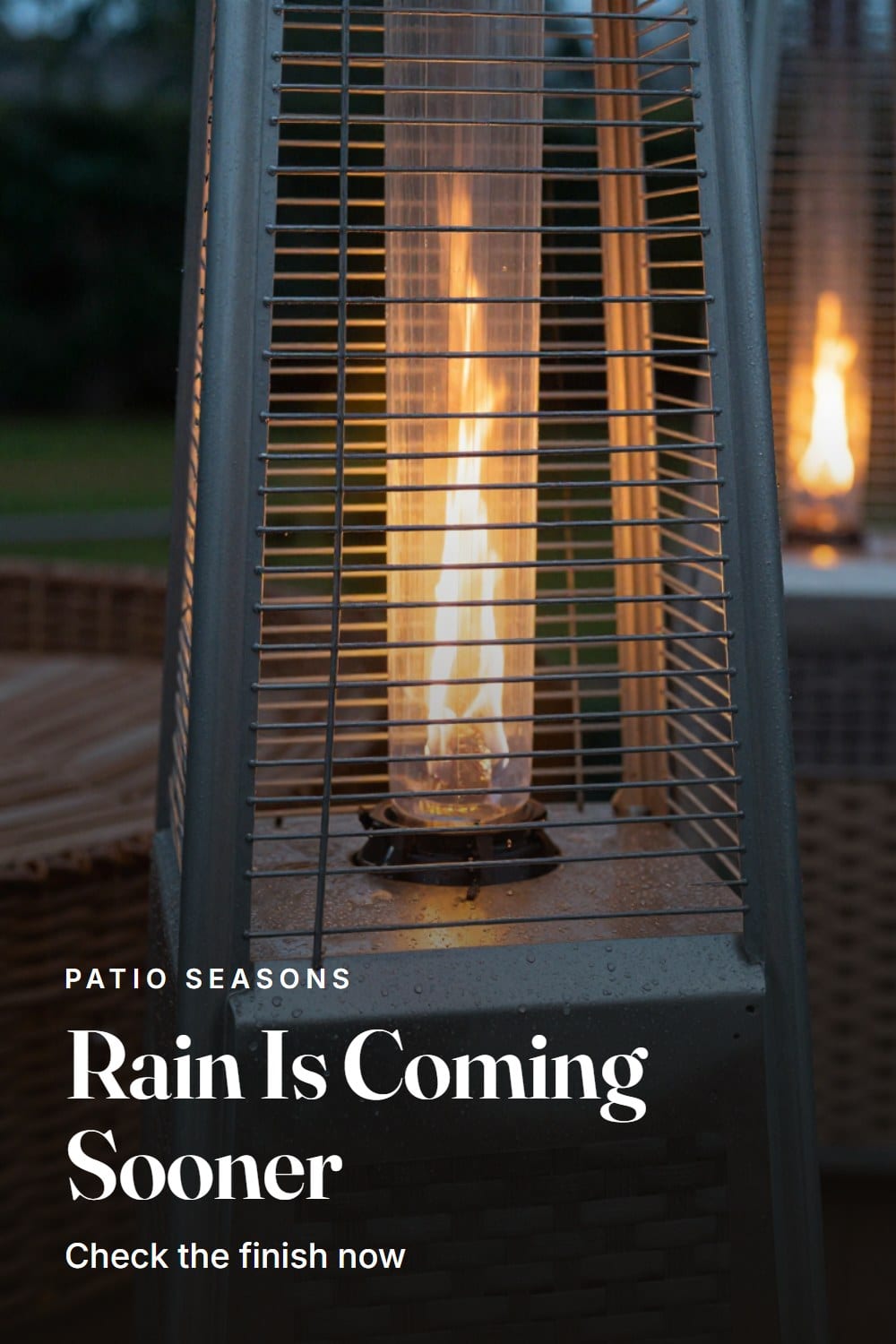 Raindrops beading across the powder-coated steel base of a patio heater