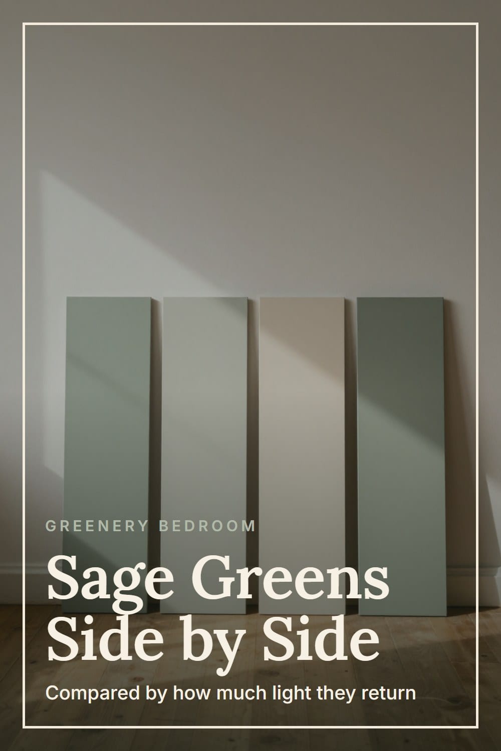 Painted sample boards in graduating sage tones leaning in a row against a plaster wall